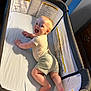 Marty is registered to the contest to win money with this photo: baby, child, clothing, crawling, crib, face, feet, furniture, hands, happy, indoor, infant, light, mesh, onesie, playpen, shorts, skin, smiling, warning_label