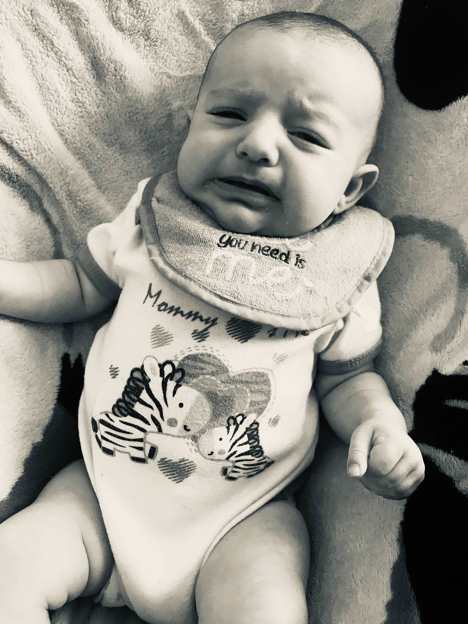 Mia Grace is registered to the contest to win money with this photo: baby, cheek, comfort, eye, eyebrow, flash_photography, gesture, hairstyle, hand, happy, human_body, iris, lip, mouth, neck, person, photograph, skin, sleeve, style