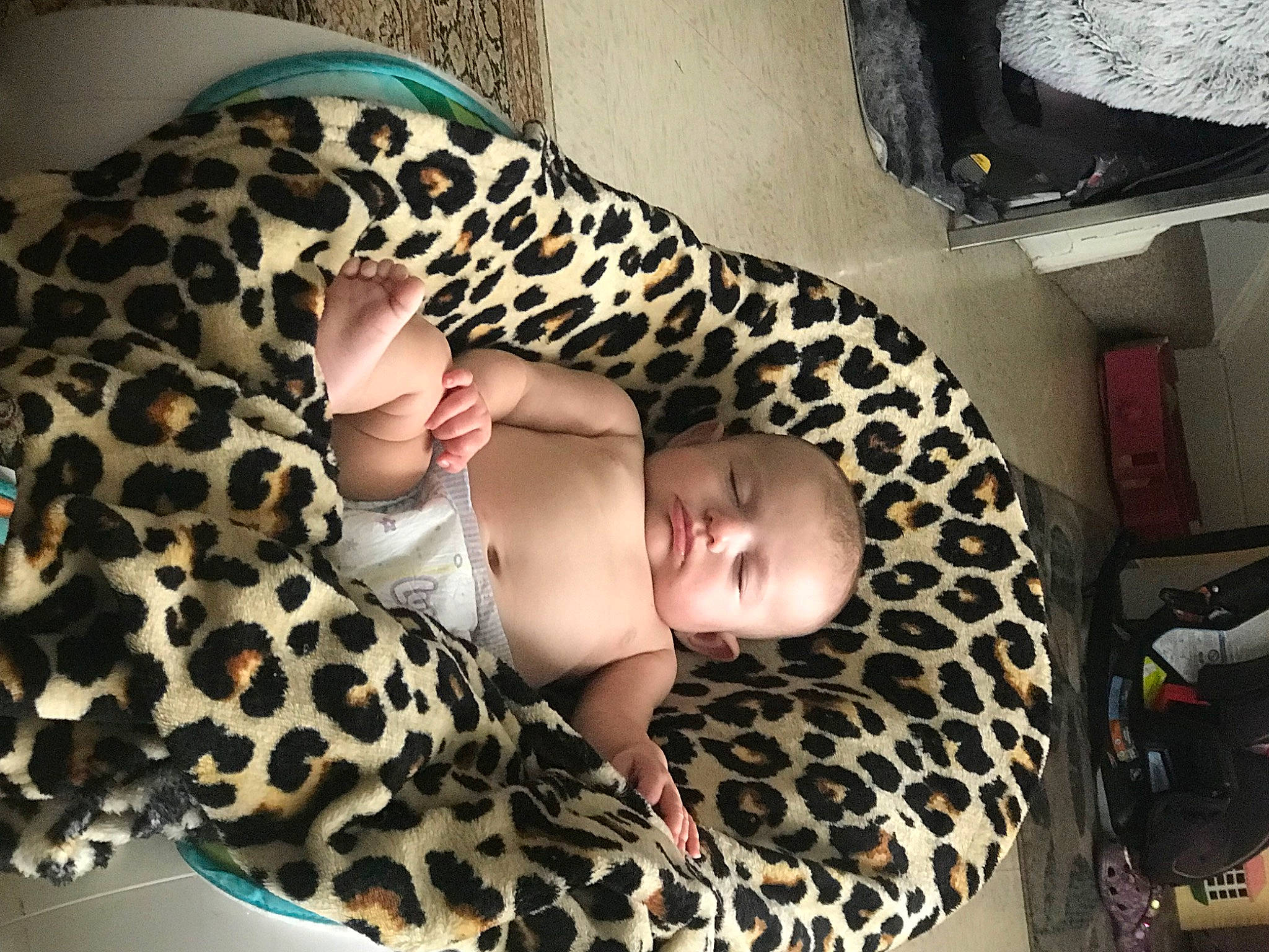 Mia Grace is registered to the contest to win money with this photo: baby, baby_toddler_clothing, child, comfort, fawn, finger, flesh, foot, fun, human_body, human_leg, nail, pattern, person, room, sitting, skin, thigh, toddler, wood