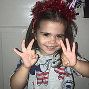 Ava is registered to the contest to win money with this photo: accessories, baby, bodypart, bracelet, clothing, costume, face, finger, hair, hand, happy, head, jewelry, mouth, person, photography, portrait, smile, t_shirt, teeth