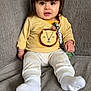 Nolan joined the competition — help win amazing prizes! baby, bodypart, clothing, couch, cushion, face, finger, footwear, furniture, hand, head, homedecor, hosiery, pants, person, photography, portrait, shoe, sitting, sock