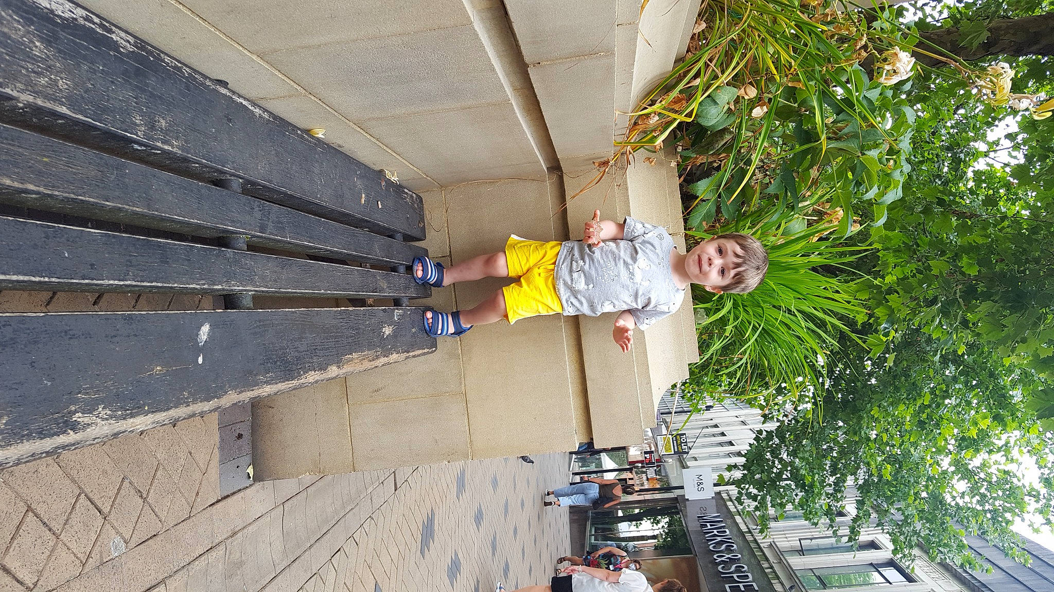 Michael is registered to the contest to win money with this photo: architecture, ceiling, concrete, engineering, facade, fun, handrail, leisure, line, person, plant, recreation, roof, smile, t_shirt, tree, wood