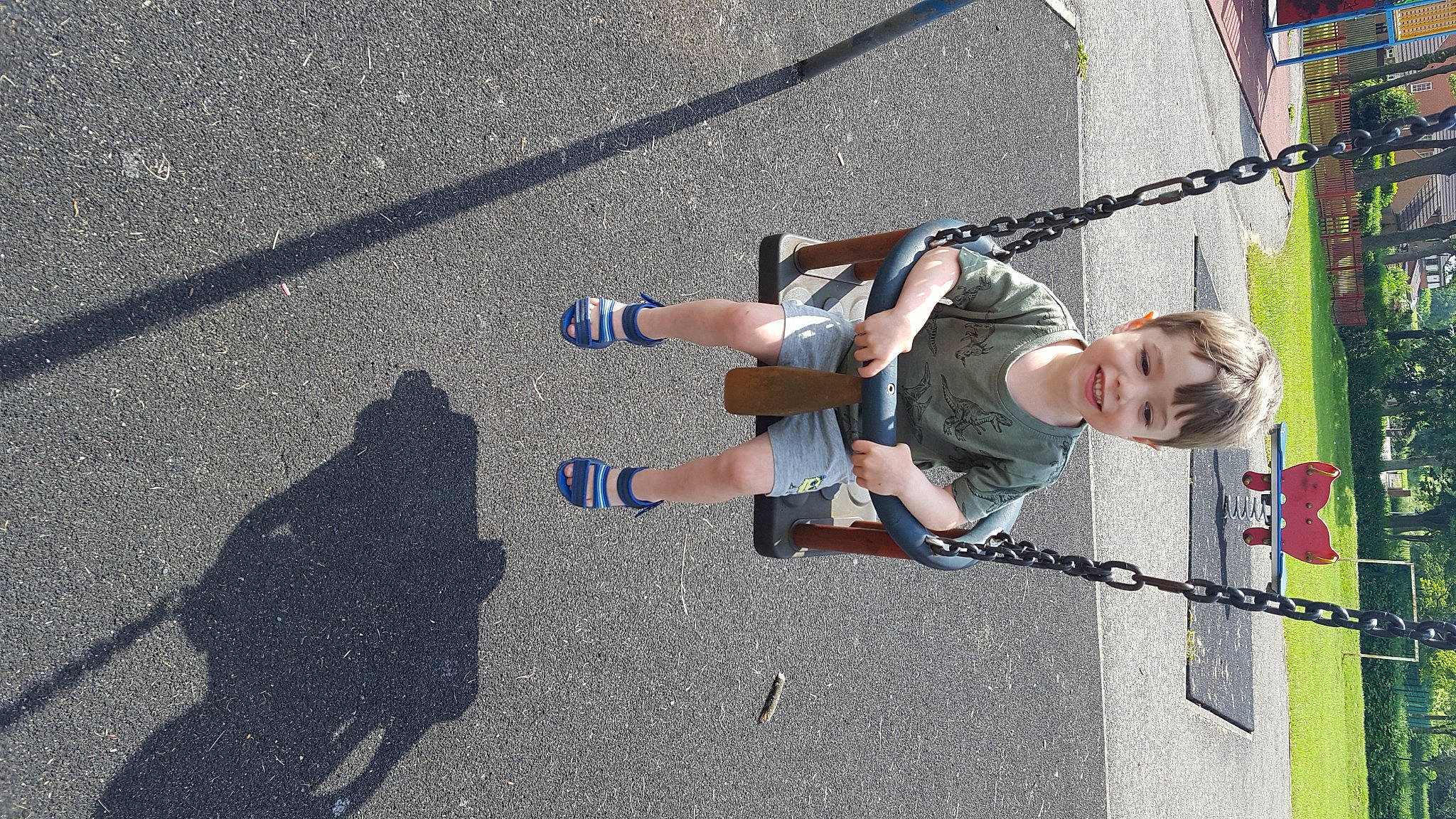 Michael is registered to the contest to win money with this photo: asphalt, city, concrete, electric_blue, fun, human_leg, joy, leg, leisure, pedestrian, person, recreation, road, road_surface, shadow, shoe, shorts, sidewalk, sneakers, tar