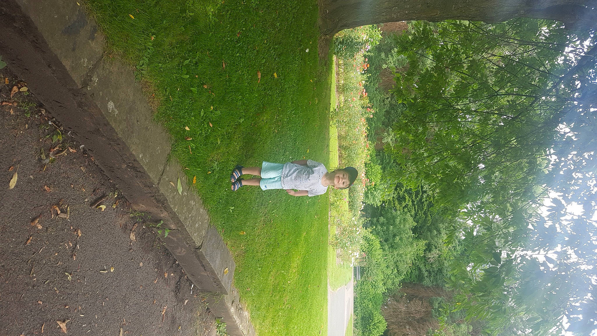 Michael is registered to the contest to win money with this photo: asphalt, fun, garden, grass, grass_family, joy, landscape, leaf, leisure, people_in_nature, person, plant, recreation, road_surface, shadow, shrub, sidewalk, slope, soil, tints_and_shades