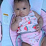Serenity is registered to the contest to win money with this photo: baby, infant, child, portrait, sitting, bouncer, baby_chair, pink, watermelon, floral_pattern, outdoor, deck, wooden_background, looking_at_camera, curious, clothing, straps, face, hands, legs