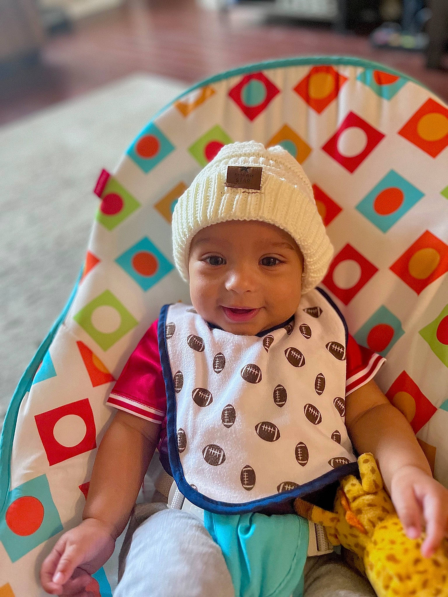 Kamden joined the competition — help win amazing prizes! baby, baby_products, baby_toddler_clothing, beanie, cap, child, comfort, fun, happy, headwear, leisure, linens, pattern, person, play, polka_dot, sitting, sleeve, smile, sweet_corn