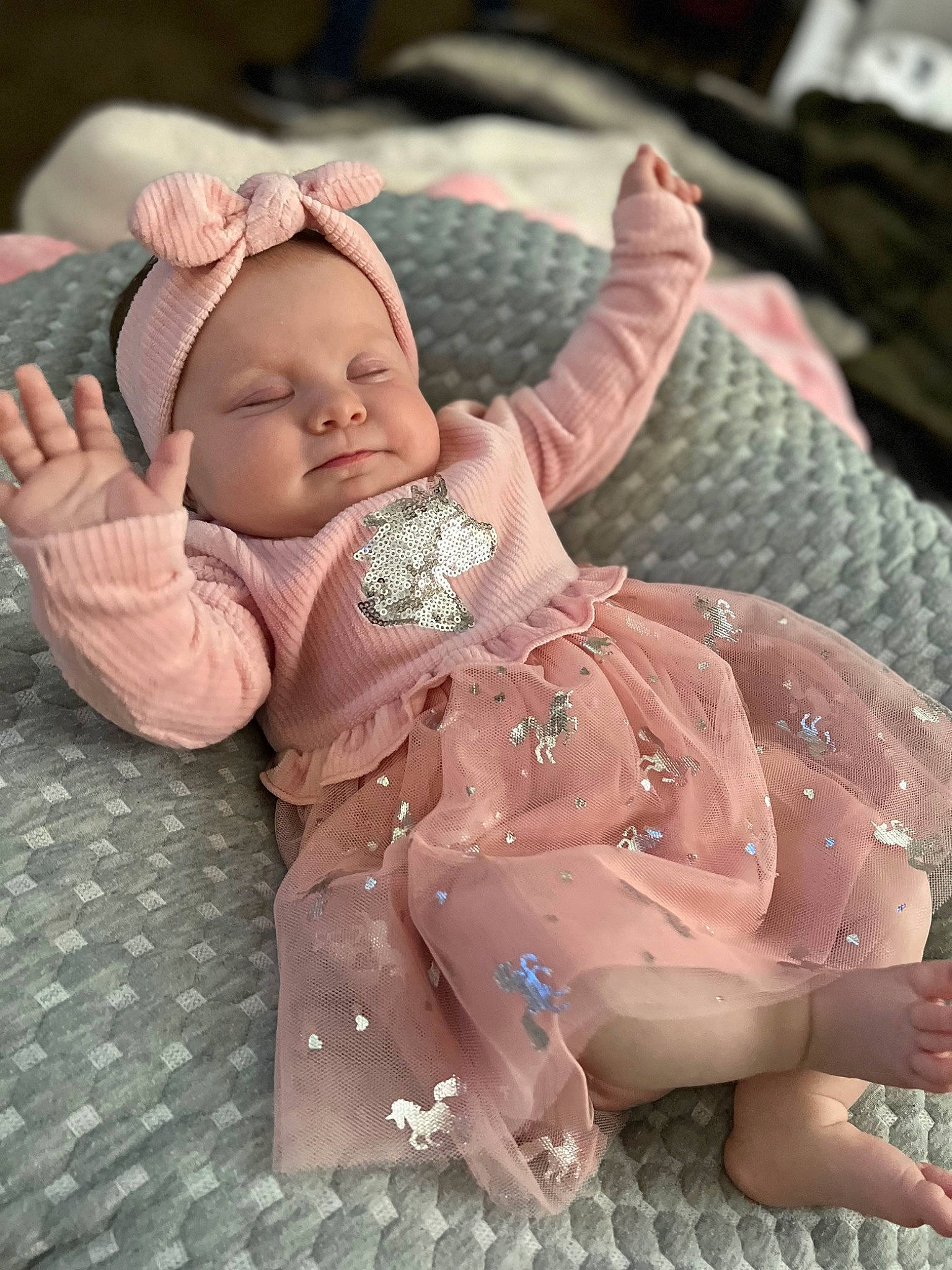 Raelynn is registered to the contest to win money with this photo: art, baby, baby_products, baby_sleeping, baby_toddler_clothing, cheek, child, comfort, grass, human_body, linens, nail, pattern, person, pink, sitting, skin, sleeve, thumb, toddler