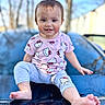 barefoot, blue_sky, car, child, clothing, cute, daylight, gray_pants, happy, hello_kitty, hood, outdoor, pink_shirt, playful, portrait, reflection, smiling, toddler, trees, young_child