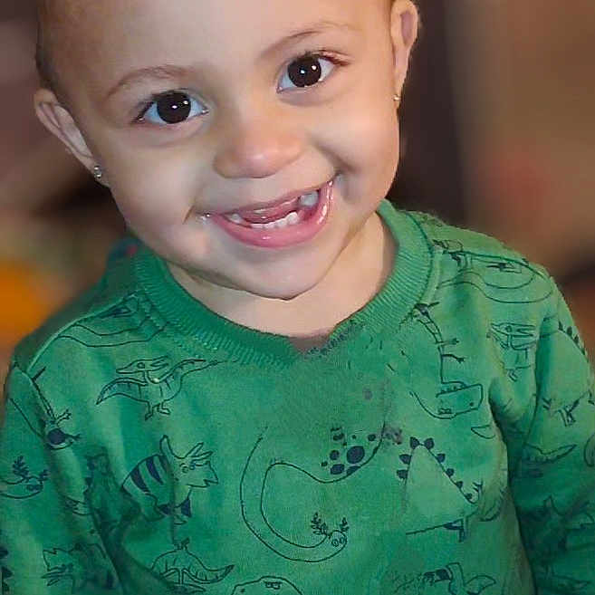 Prince Angel is registered to the contest to win money with this photo: baby, babylaughing, bodypart, clothing, dimples, face, hair, happy, head, laughing, longsleeve, mouth, person, photography, portrait, shirt, sleeve, smile, t_shirt, teeth