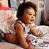 Greeicy joined the competition — help win amazing prizes! baby, child, curly_hair, blanket, bedroom, mirror, soft_toy, striped_dress, cute, smiling, indoors, furniture, pillow, plush, person, toddler, happy, skin, crawling, decor