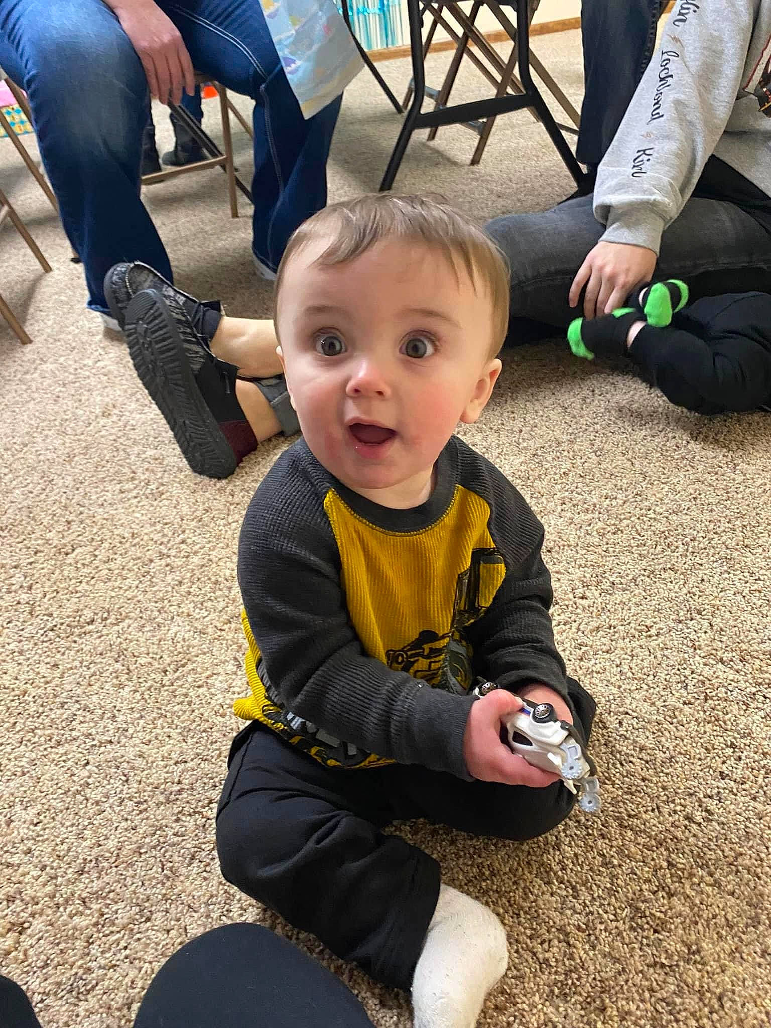 Jalen is registered to the contest to win money with this photo: asphalt, baby, baby_toddler_clothing, child, clothing, flooring, fun, grass, happy, jeans, leg, person, photograph, recreation, shoe, smile, snapshot, sneakers, surprise, toddler