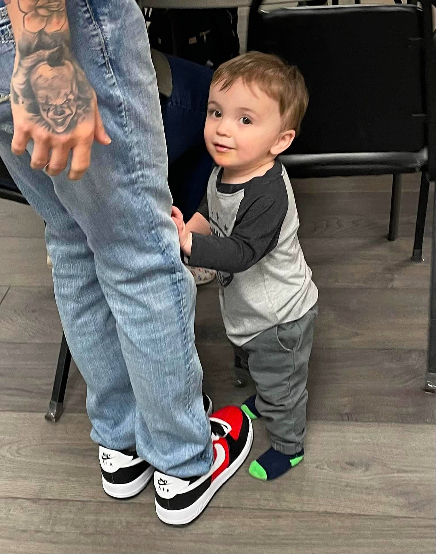 Jalen is registered to the contest to win money with this photo: cool, denim, eye, floor, flooring, footwear, formal_wear, fun, gesture, happy, human_leg, jeans, joint, leg, person, sleeve, sneakers, standing, thigh, toddler
