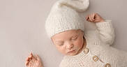 Greylan joined the competition — help win amazing prizes! baby, buttons, child, closed_eyes, cozy, cute, delicate, gentle_lighting, hands, infant, knit_hat, knit_sweater, neutral_background, newborn, peaceful, portrait, resting, sleeping, soft_texture, warm