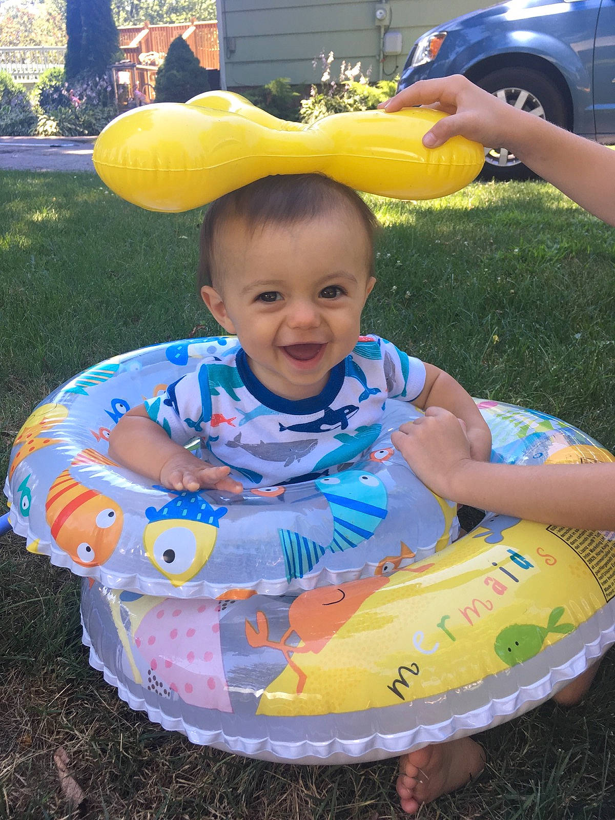 Teddy is registered to the contest to win money with this photo: baby_products, child, fun, infant, inflatable, joy, leisure, person, play, product, recreation, smile, summer, toddler, toy, vacation, water, yellow