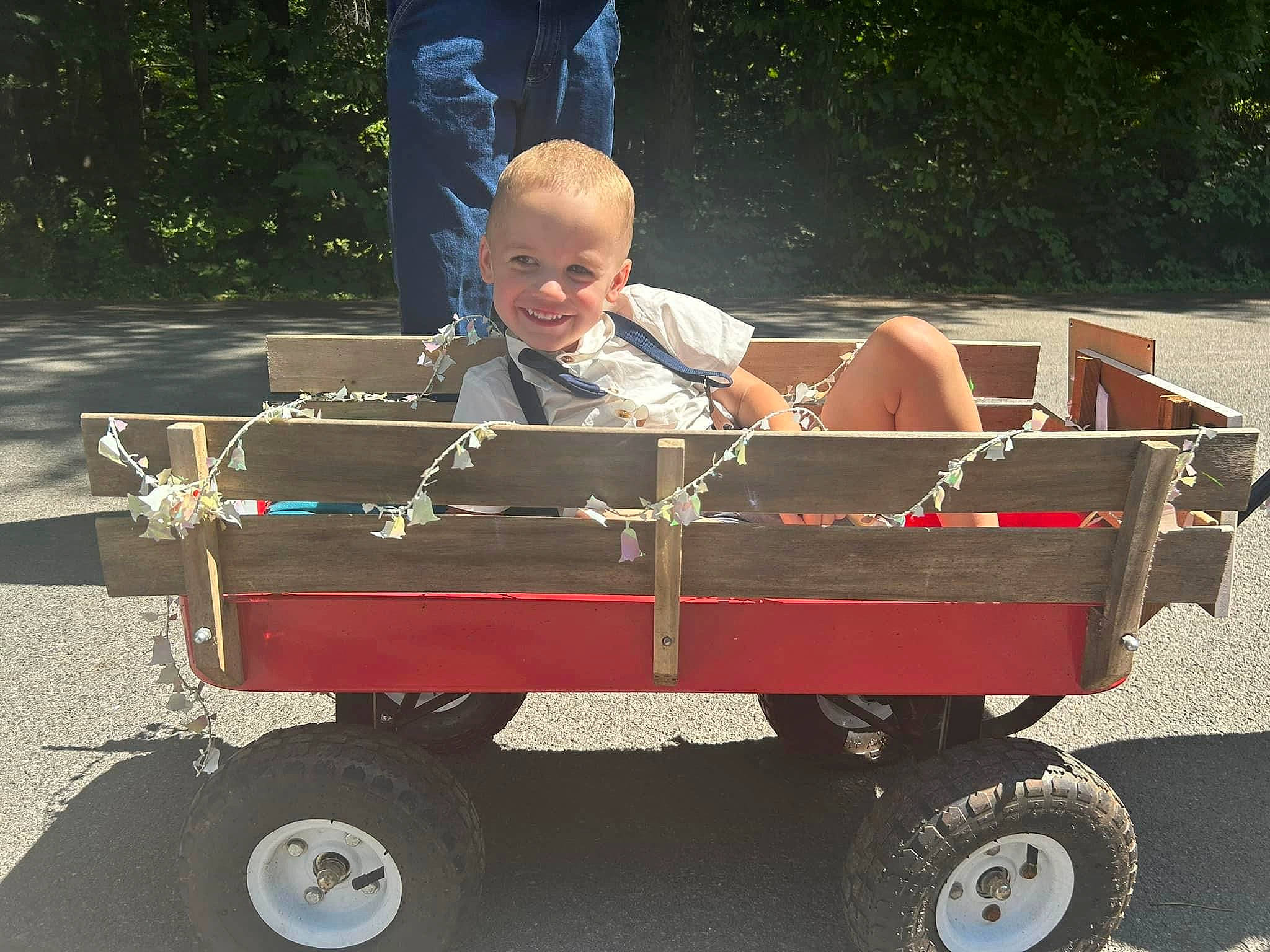 Greyson joined the competition — help win amazing prizes! auto_part, automotive_exterior, automotive_tire, automotive_wheel_system, baby_toddler_clothing, cart, child, fun, grass, joy, leisure, motor_vehicle, person, plant, rolling, sitting, smile, tire, toddler, vehicle