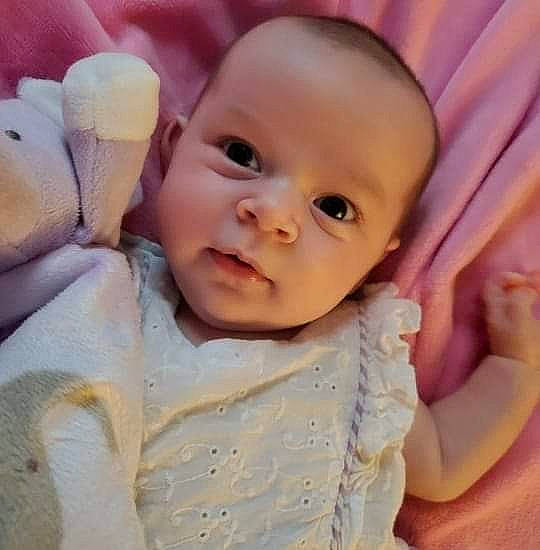 Isabelle joined the competition — help win amazing prizes! baby, baby_sleeping, baby_toddler_clothing, cheek, chin, comfort, finger, gesture, happy, linens, lip, mouth, nose, person, pink, skin, sleeve, smile, textile, thumb