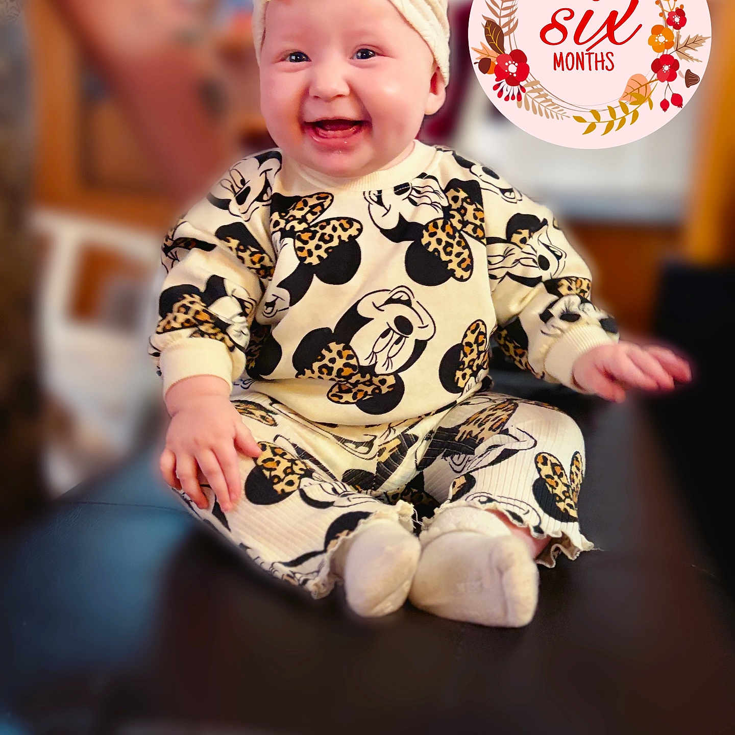 Amiyah joined the competition — help win amazing prizes! baby, infant, smiling, sitting, headband, clothing, cute, indoor, child, portrait, happy, person, leopard_print, mickey_mouse, apparel, young_child, headwear, blush, cheerful, decorative_text