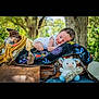 Blake joined the competition — help win amazing prizes! baby, blanket, saddle, rope, toy, cow, outdoor, nature, tree, wood, infant, clothing, resting, cute, colorful, fabric, peaceful, animal_toy, soft_toy, wood_texture