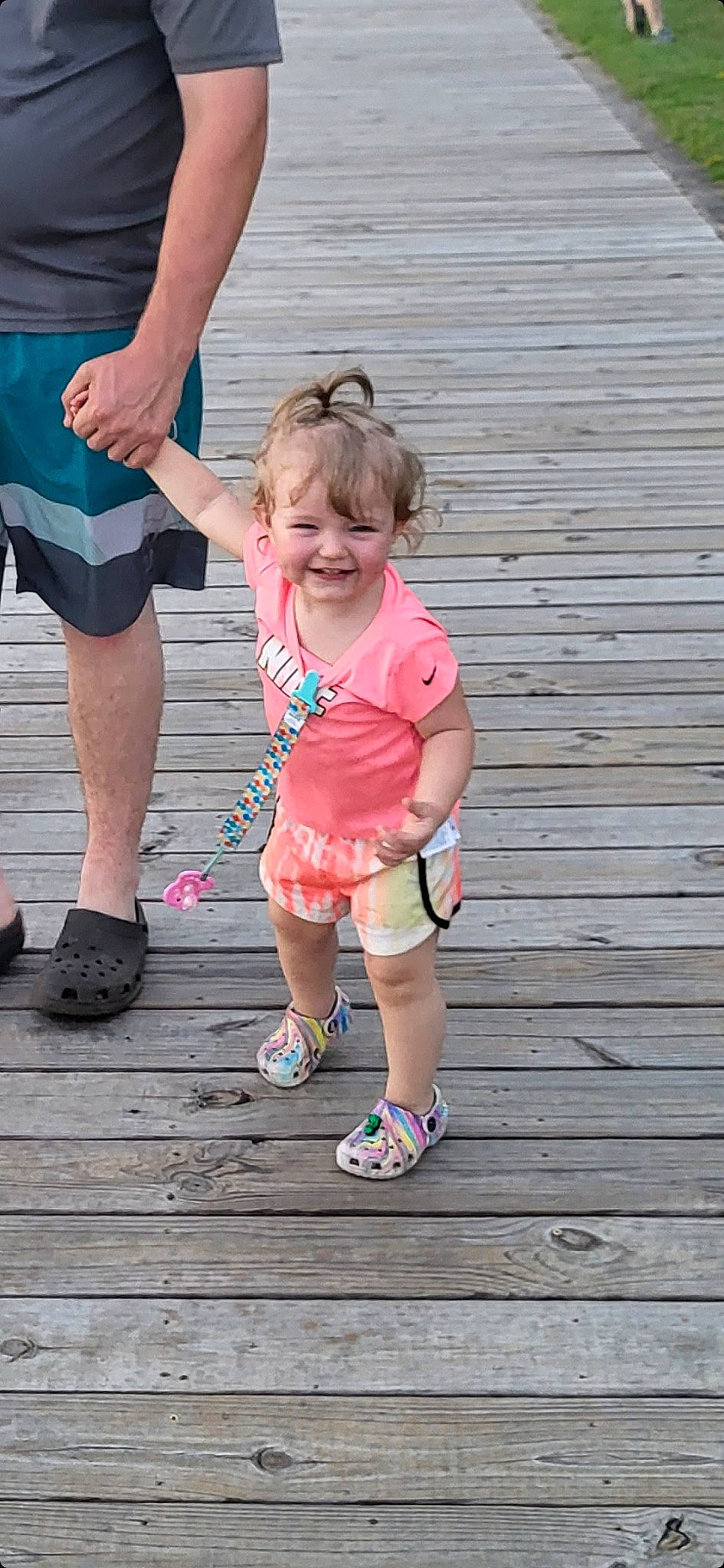 Ayla joined the competition — help win amazing prizes! baby_toddler_clothing, blue, footwear, fun, gesture, happy, joy, leg, leisure, magenta, people_in_nature, person, pink, sandal, shoe, shorts, smile, sneakers, standing, summer