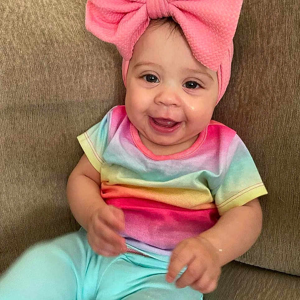 Kaylinn joined the competition — help win amazing prizes! baby, babylaughing, clothing, face, happy, hat, head, laughing, person, photography, portrait, sitting, smile