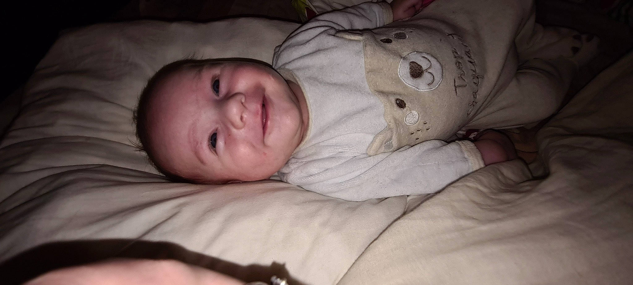 Ezio participe au concours pour gagner de l'argent avec cette photo : baby, bedtime, cheek, chin, comfort, eye, eyebrow, face, forehead, hair, hand, head, headgear, iris, linens, lip, mouth, nose, person, skin