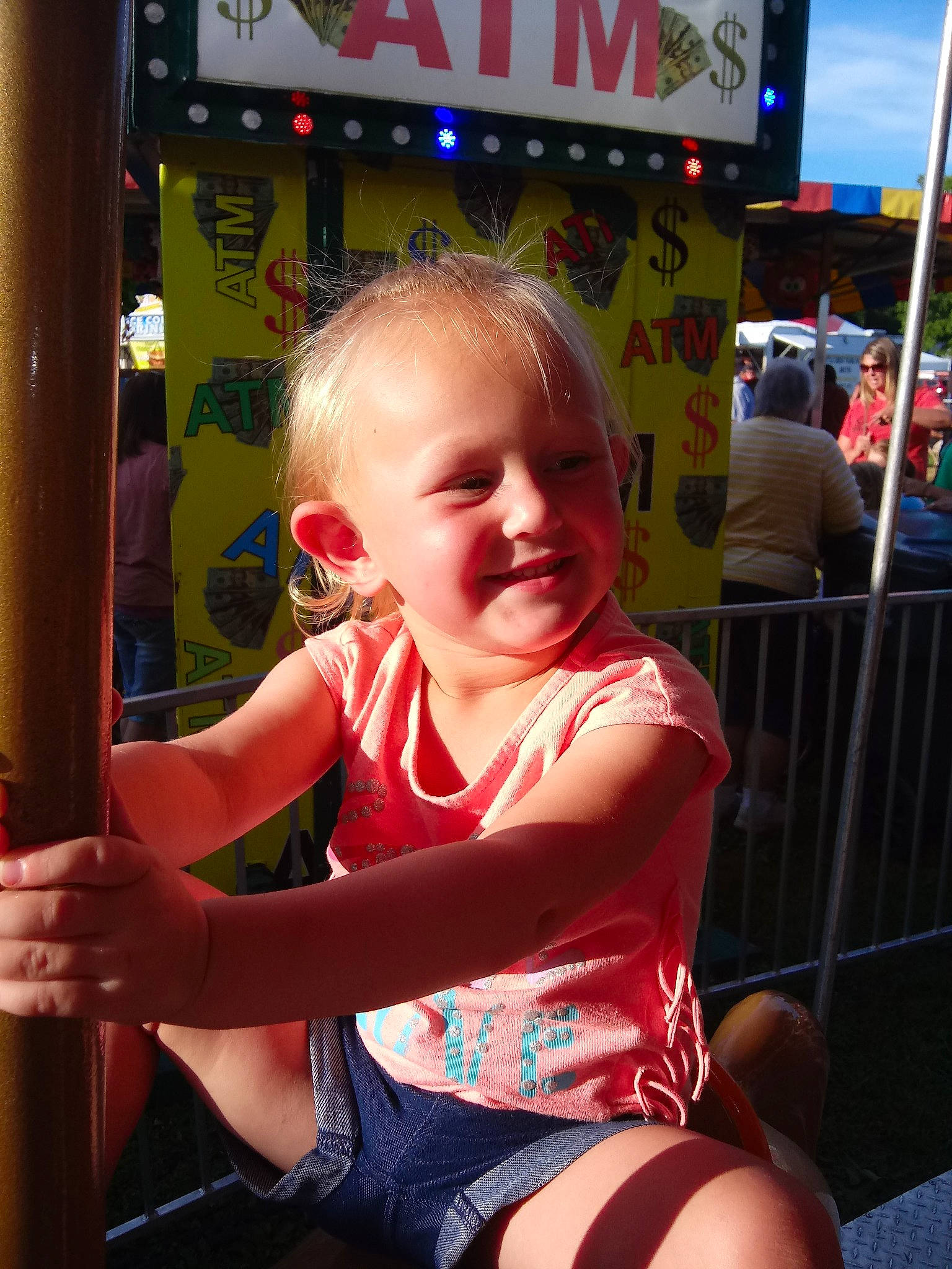 Mayabella joined the competition — help win amazing prizes! amusement_park, amusement_ride, blond, child, fun, joy, leisure, nonbuilding_structure, person, playground, public_space, recreation, sitting, smile, summer, toddler, vacation