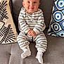 Nehoray participe au concours pour gagner de l'argent avec cette photo : baby, child, comfort, couch, cozy, cute, furniture, happy, home, indoor, infant, living_room, pajamas, person, pillows, portrait, seated, smiling, socks, striped_clothing