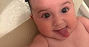 Nova joined the competition — help win amazing prizes! baby, bath, child, closeup, cute, expression, face, fun, happy, indoors, infant, mischievous, person, playful, portrait, skin, smiling, tongue_out, water, wet_hair