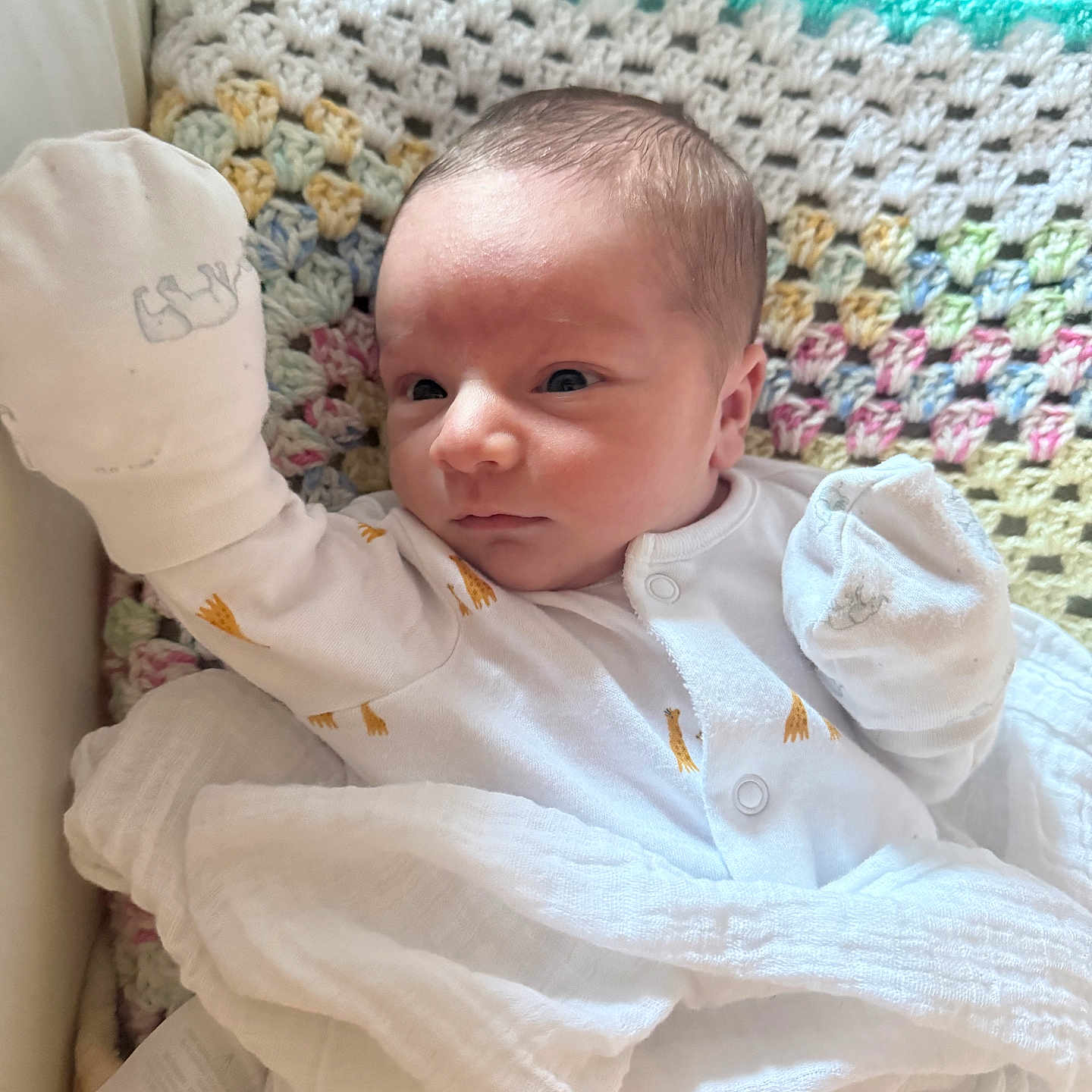 Tyler joined the competition — help win amazing prizes! baby, blanket, clothing, colorful, cozy, crochet, cute, face, indoors, infant, lying_down, mittens, newborn, person, portrait, resting, sleepwear, soft_texture, white, young_child