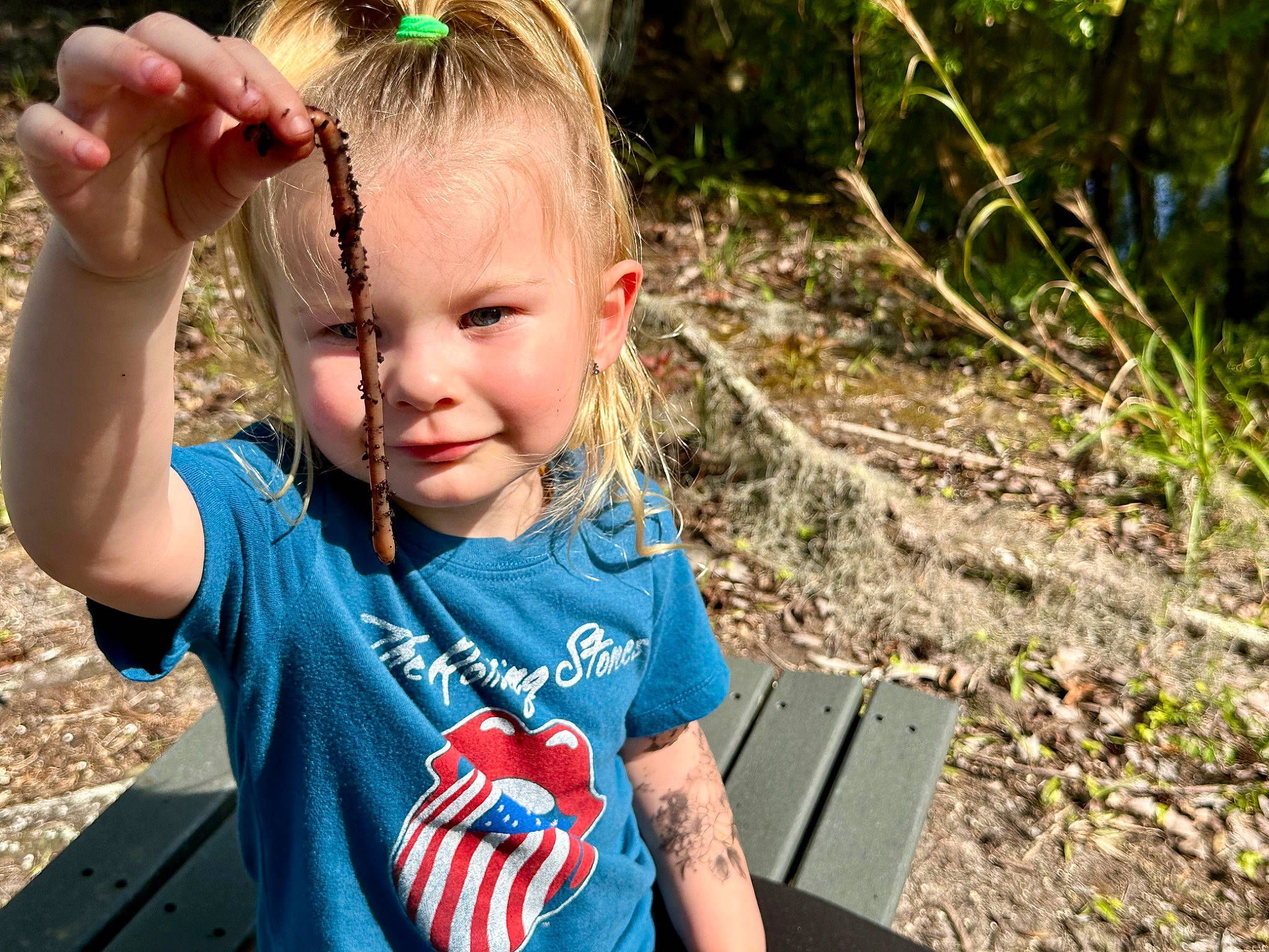 Pyper is registered to the contest to win money with this photo: baby_toddler_clothing, blond, child, electric_blue, fun, grass, hairstyle, happy, joy, leisure, people_in_nature, person, personal_protective_equipment, plant, play, recreation, smile, soil, t_shirt, toddler