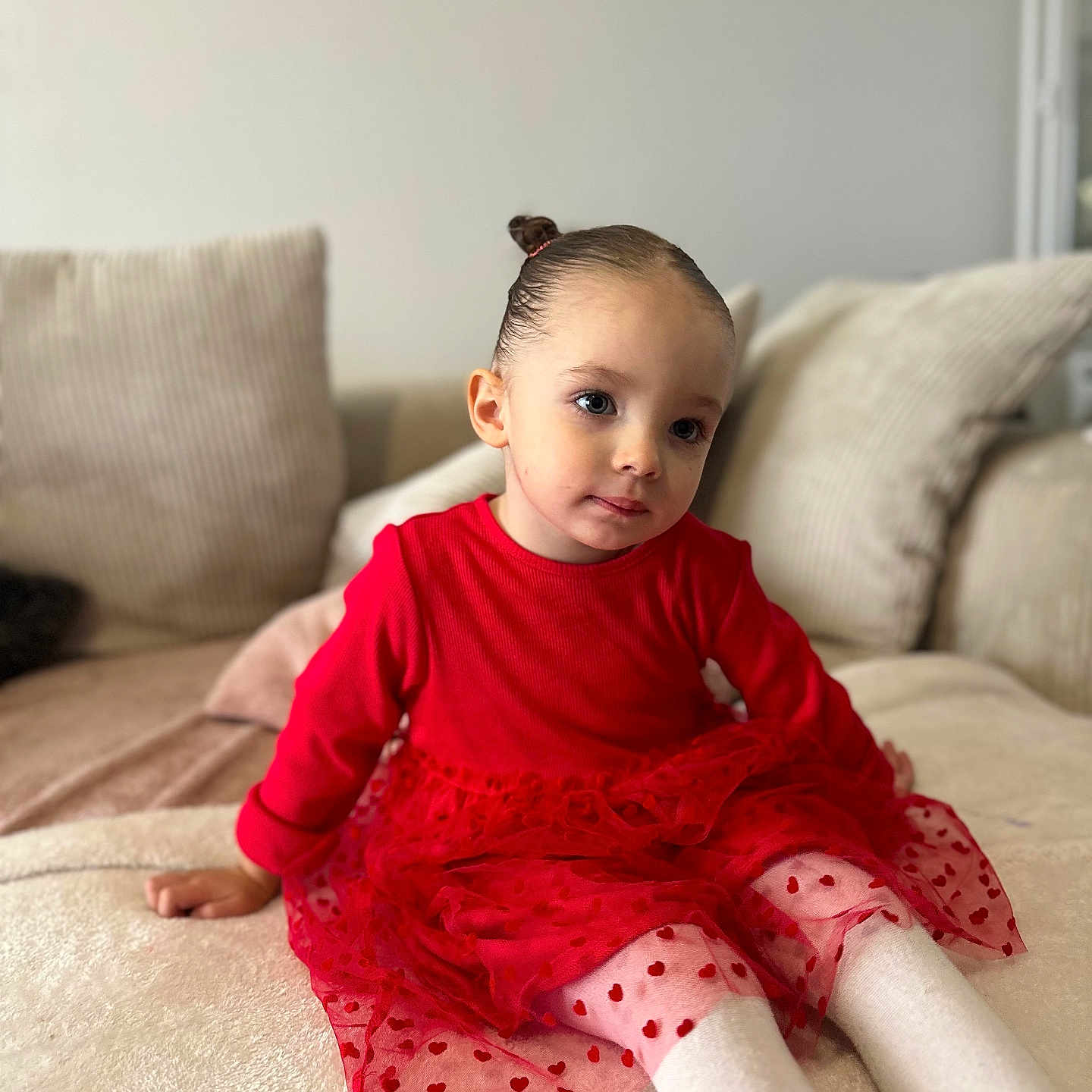 Mya participe au concours pour gagner de l'argent avec cette photo : baby, bed, bedroom, clothing, couch, cushion, dress, face, furniture, happy, head, homedecor, indoors, person, photography, portrait, room, sitting, sleeve, smile