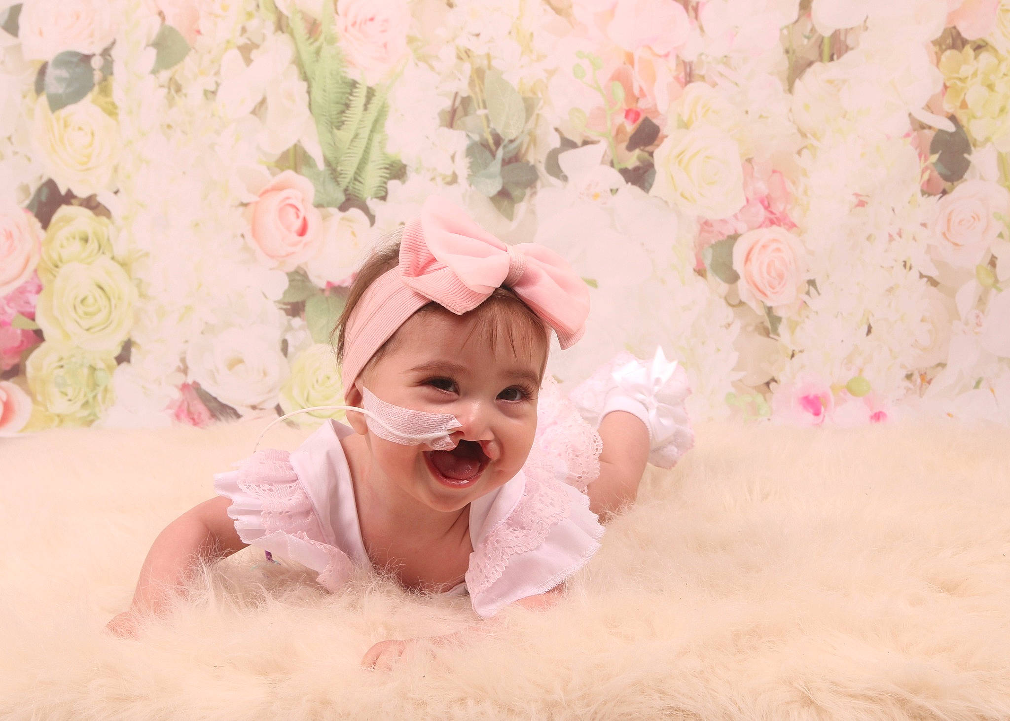 Ayda is registered to the contest to win money with this photo: baby, baby_toddler_clothing, child, flash_photography, flower, fun, grass, happy, head, magenta, peach, people_in_nature, person, petal, pink, plant, rose, smile, sweetness, textile