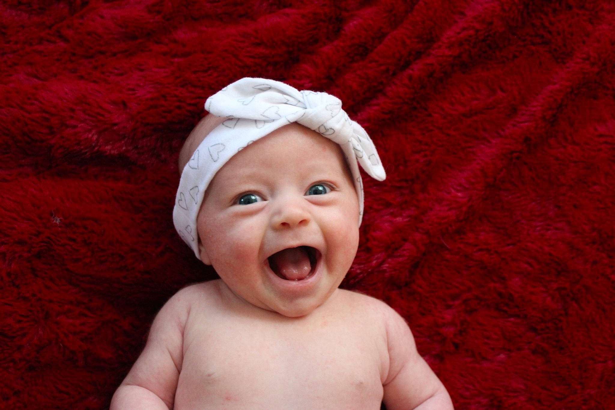 Tinley joined the competition — help win amazing prizes! baby, baby_laughing, baby_making_funny_faces, cheek, child, facial_expression, happy, head, headgear, headwear, laugh, lip, mouth, person, portrait_photography, red, smile, toddler, yawn