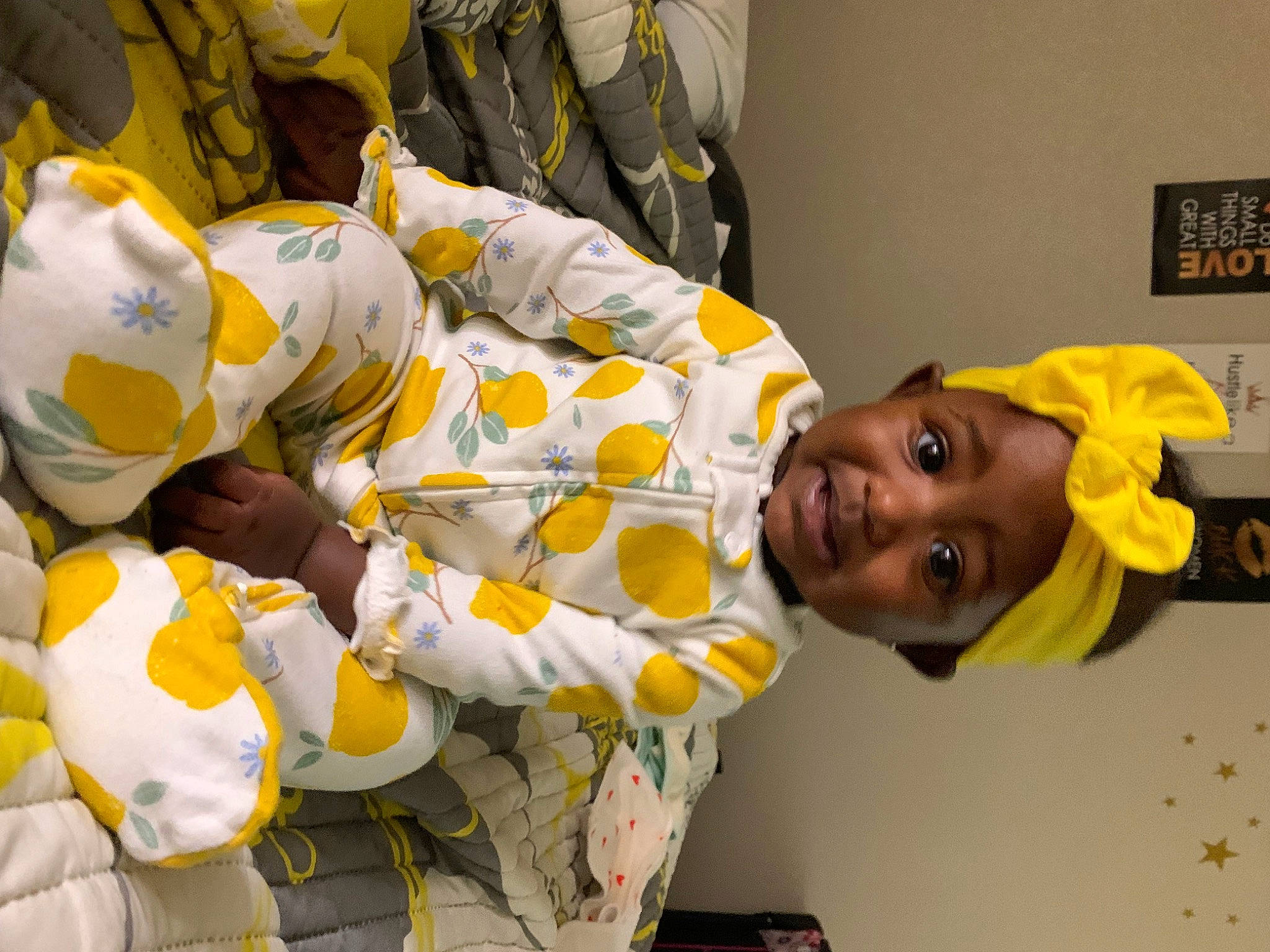 Taylor is registered to the contest to win money with this photo: child, event, fun, happy, hat, headwear, person, picture_frame, plant, room, smile, t_shirt, toddler, uniform, yellow