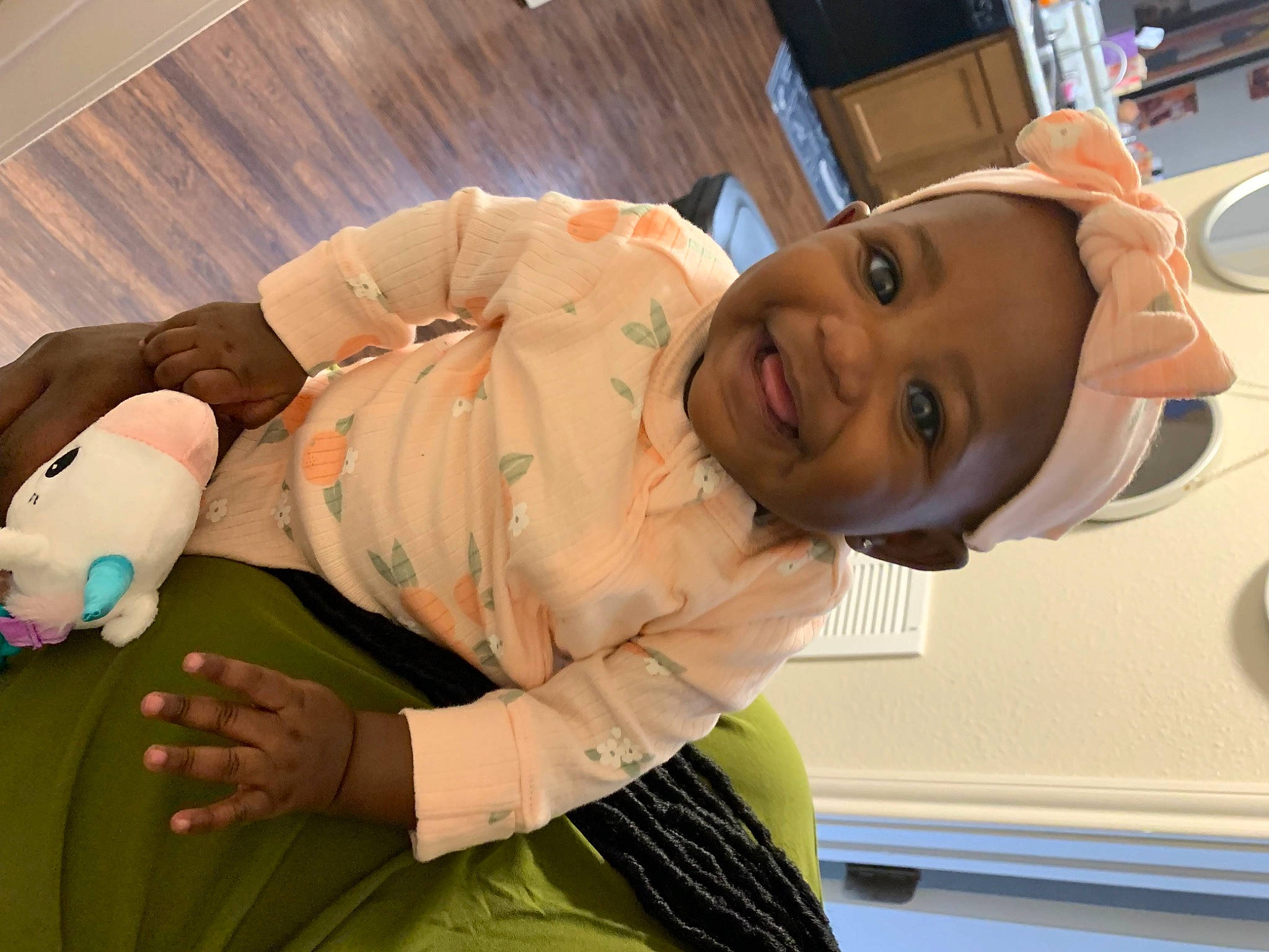 Taylor is registered to the contest to win money with this photo: abdomen, baby, baby_toddler_clothing, child, comfort, elbow, event, finger, fun, happy, human_body, joy, knee, mouth, person, room, sitting, sleeve, smile, thumb