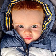 Noé participe au concours pour gagner de l'argent avec cette photo : toddler, child, face, blue_eyes, hooded_jacket, winter_clothing, zipper, closeup, portrait, cute, baby, outerwear, young_child, curious, innocent, person, skin, head, warm_clothing, expression