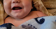 Henry joined the competition — help win amazing prizes! baby, smiling, blanket, hand, cozy, hood, cute, infant, portrait, happy, child, skin, face, expression, warm, closeup, indoors, soft, tender, comfort