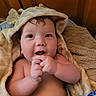 Henry is registered to the contest to win money with this photo: baby, infant, child, towel, hooded_towel, giraffe_pattern, blanket, smiling, happy, cute, indoors, skin, face, hand, expression, cozy, soft, wrapped, portrait, young