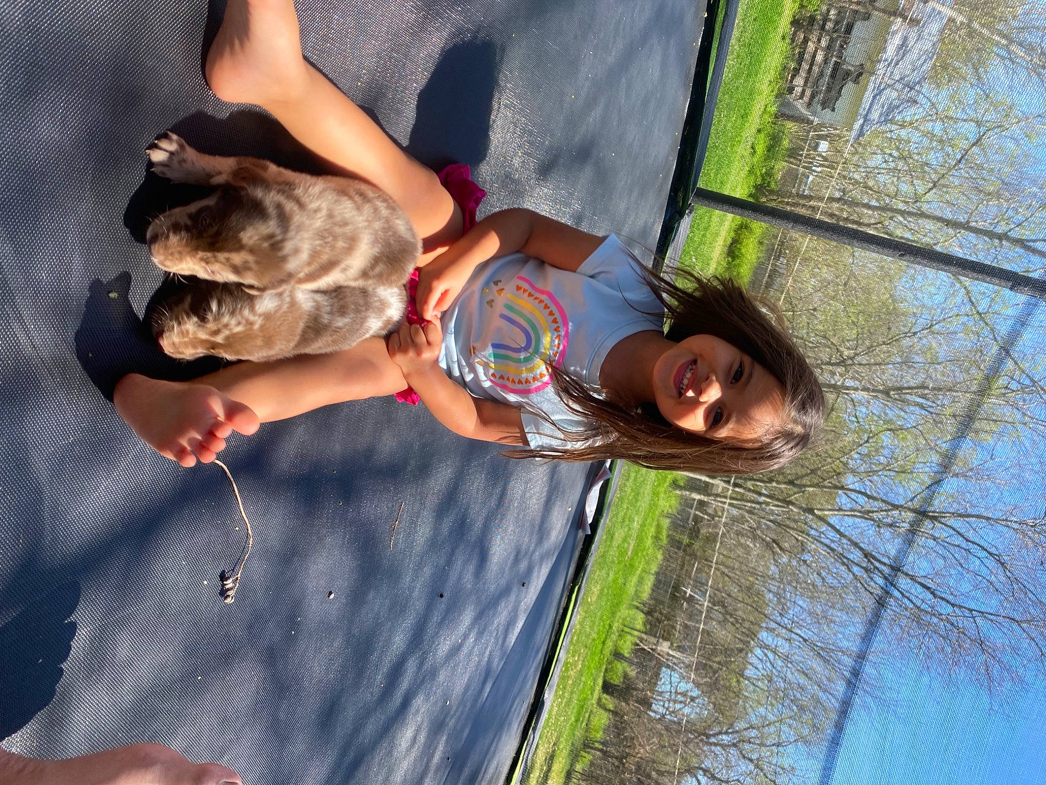 Brynleigh is registered to the contest to win money with this photo: child, companion_dog, dog, dog_breed, fun, grass, happy, joy, leisure, people_in_nature, person, plant, recreation, reflection, smile, toddler, tree, vacation, water