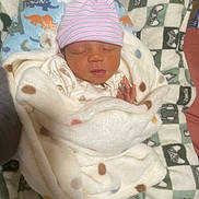 Amerious is registered to the contest to win money with this photo: newborn, baby, sleeping, blanket, hat, infant, cozy, sleep, cute, patterned_blanket, child, soft, resting, pink_hat, wrapped, indoor, portrait, baby_clothing, peaceful, warm
