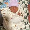 newborn, baby, sleeping, blanket, hat, infant, cozy, sleep, cute, patterned_blanket, child, soft, resting, pink_hat, wrapped, indoor, portrait, baby_clothing, peaceful, warm