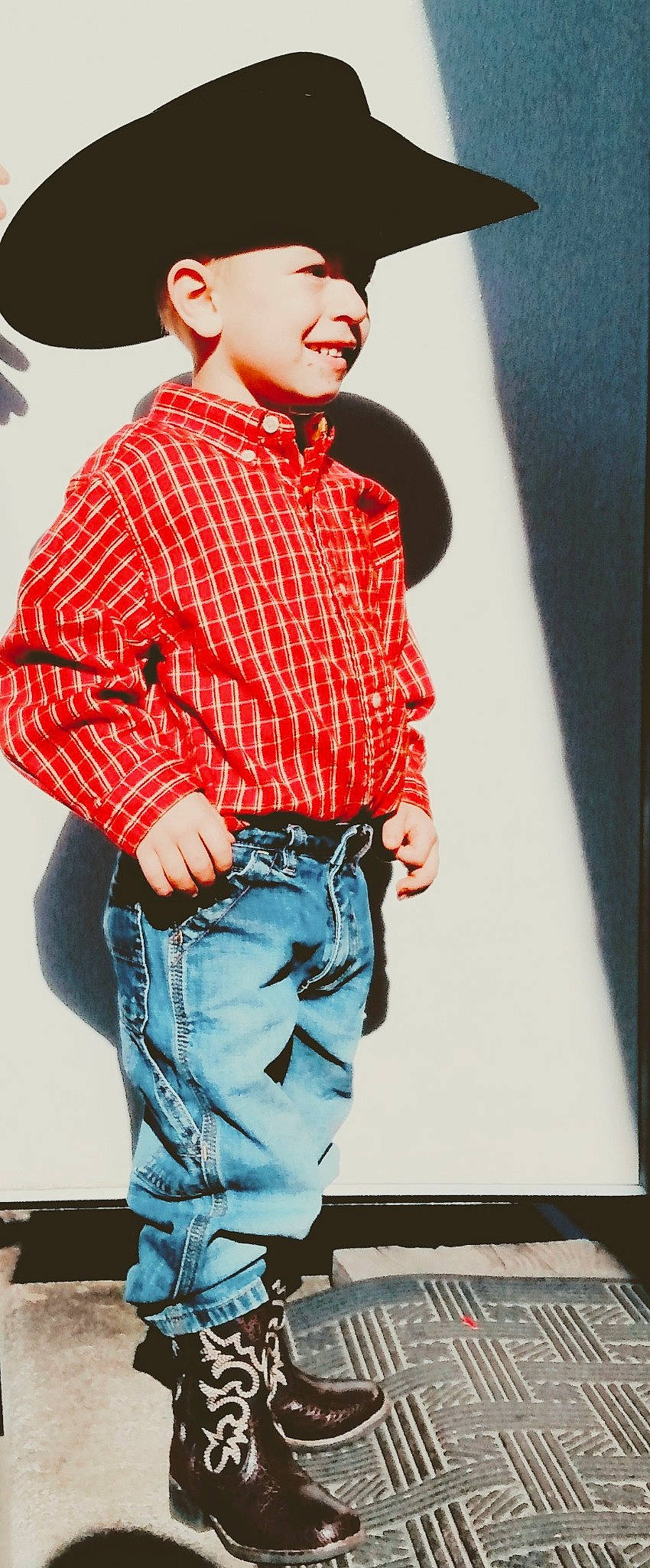 Ryker is registered to the contest to win money with this photo: belt, button, clothing, collar, cool, denim, dress_shirt, jeans, pattern, person, photo_shoot, plaid, pocket, shirt, sleeve, standing, street_fashion, tartan, textile, top