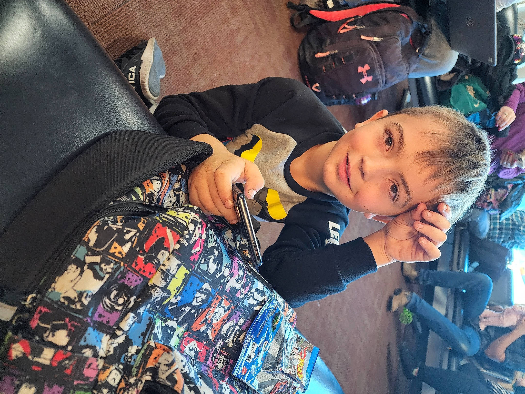 Kaiden is registered to the contest to win money with this photo: auto_part, baby_products, car_seat, child, cool, electric_blue, fashion_accessory, fun, happy, joy, leisure, person, personal_protective_equipment, recreation, room, smile, toddler, tree