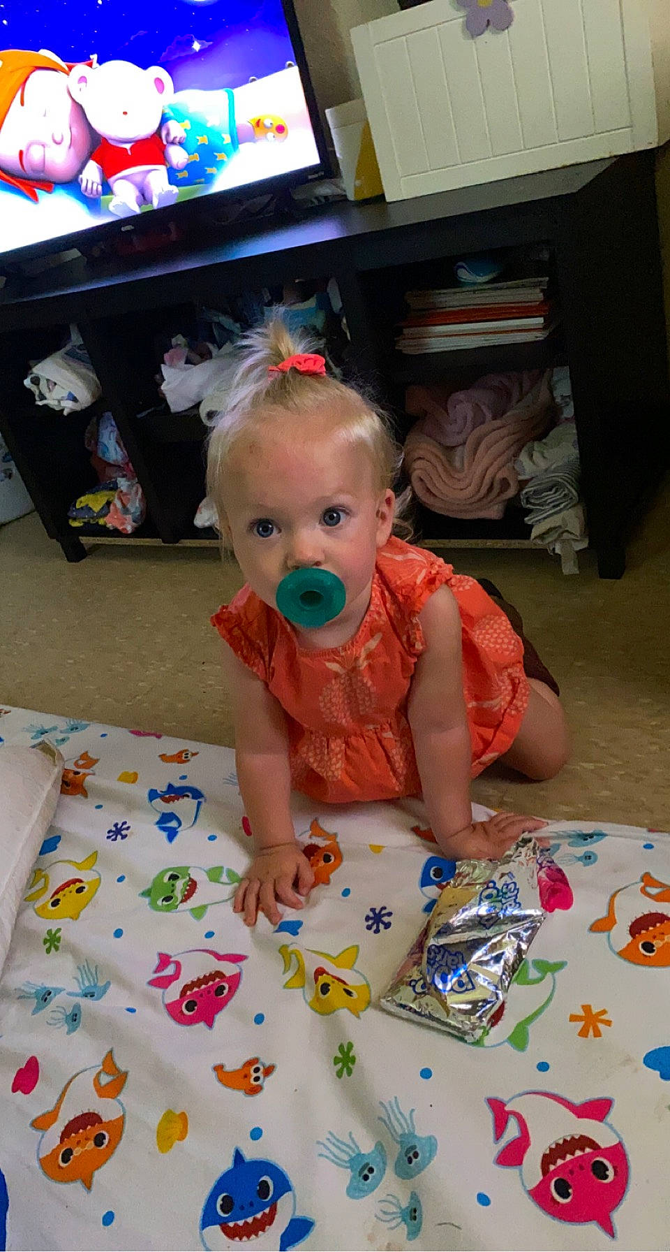 Payzlie is registered to the contest to win money with this photo: art, baby, baby_products, baby_toddler_clothing, box, child, dress, floor, flooring, fun, party, pattern, person, picture_frame, play, product, room, sitting, surprise, television