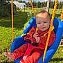 Jimmy is registered to the contest to win money with this photo: baby, child, swing, outdoor, grass, sunlight, sunglasses, playground, smiling, blue_swing, orange_clothing, barefoot, rope, garden, daylight, person, infant, nature, greenery, happy