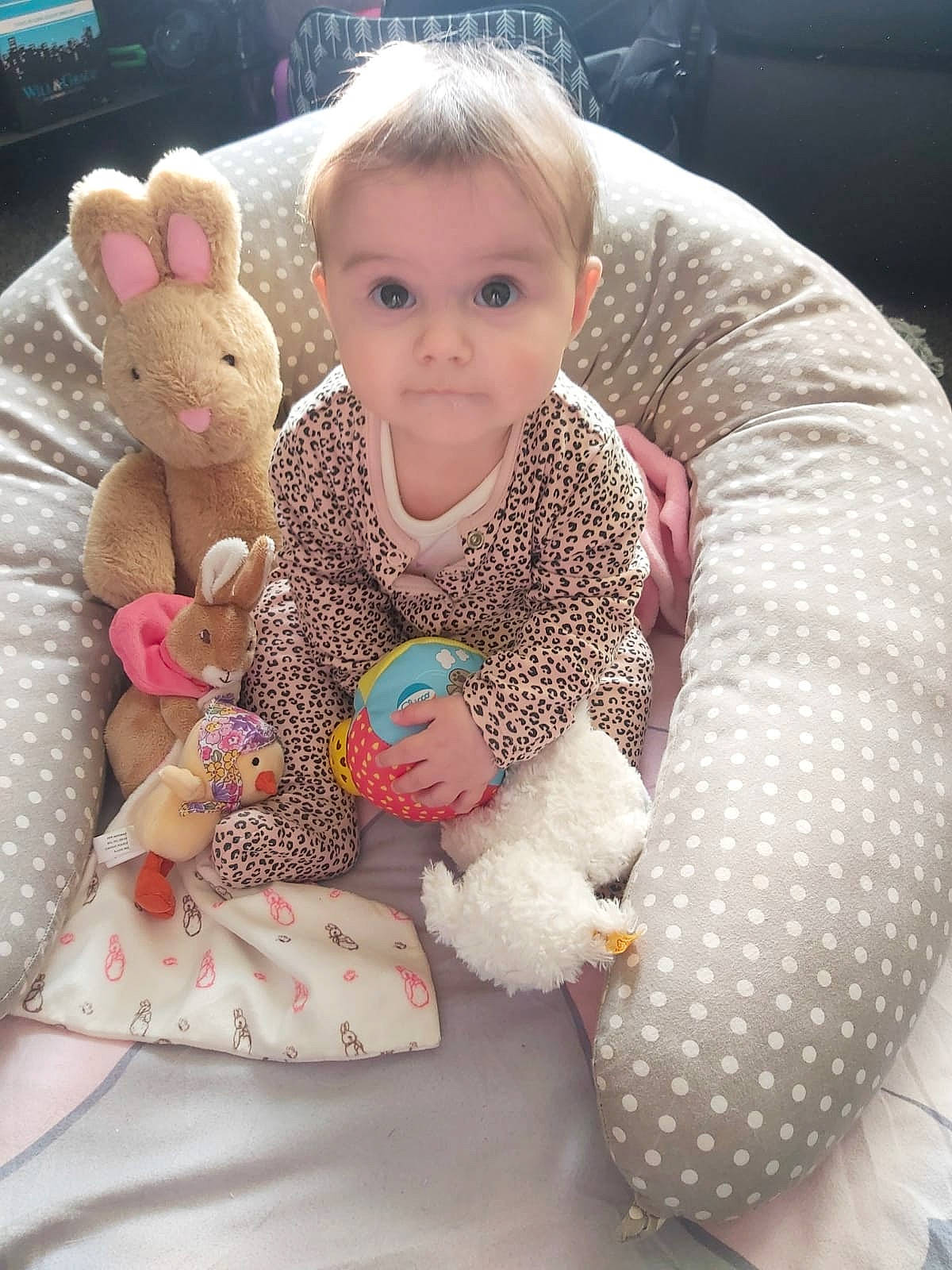 Mia joined the competition — help win amazing prizes! arm, baby, baby_toddler_clothing, cheek, comfort, eye, finger, hand, head, human_body, lap, leg, linens, outerwear, person, pink, skin, sleeve, stuffed_toy, textile