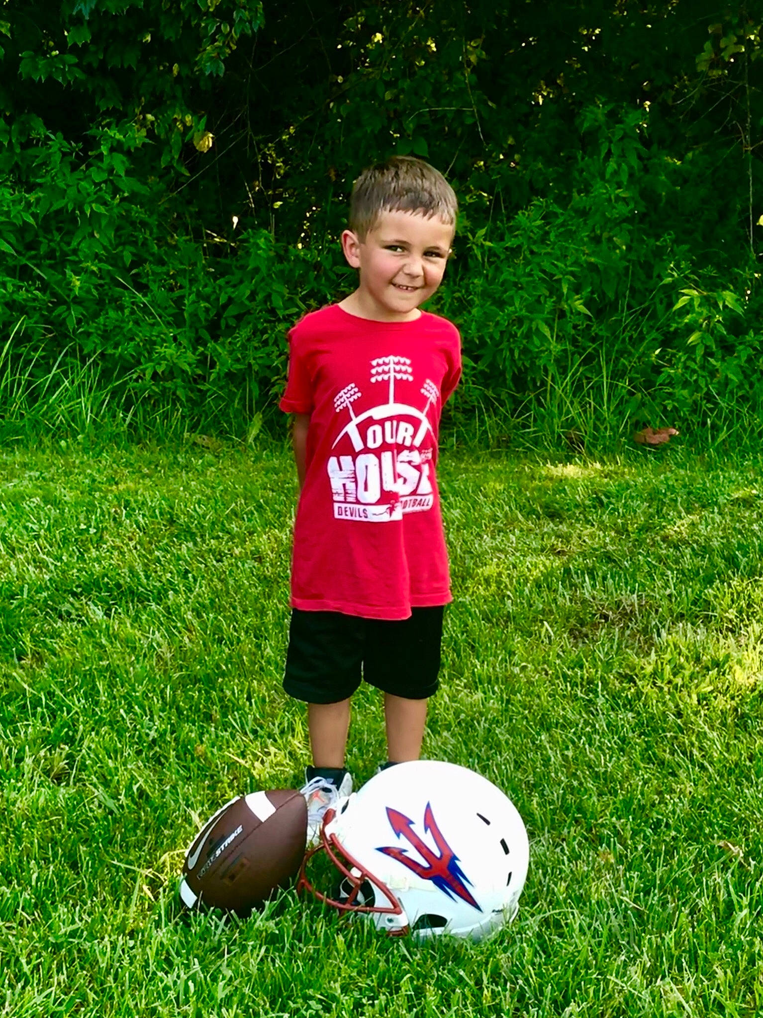 Xavier is registered to the contest to win money with this photo: ball, ball_game, child, football, football_player, fun, grass, joy, lawn, person, plant, play, soccer, soccer_ball, soccer_player, sports_equipment, team_sport