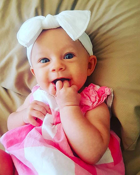 Amaia is registered to the contest to win money with this photo: beauty, cheek, child, girl, hair_accessory, hand, happiness, headband, infant, pink, product, skin, smile, toddler