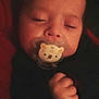 Timéo participe au concours pour gagner de l'argent avec cette photo : baby, pacifier, koala, sleeping, hand, face, child, infant, dark_clothing, cozy, peaceful, closeup, portrait, indoor, sleep, cute, soft_light, warm_tones, hand_clenched, young