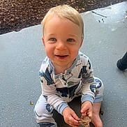 Jack joined the competition — help win amazing prizes! toddler, child, baby, smiling, dinosaur_pajamas, barefoot, leaf, porch, outdoor, garden, mulch, curious, happy, sitting, playful, daylight, person, closeup, casual_clothing, nature